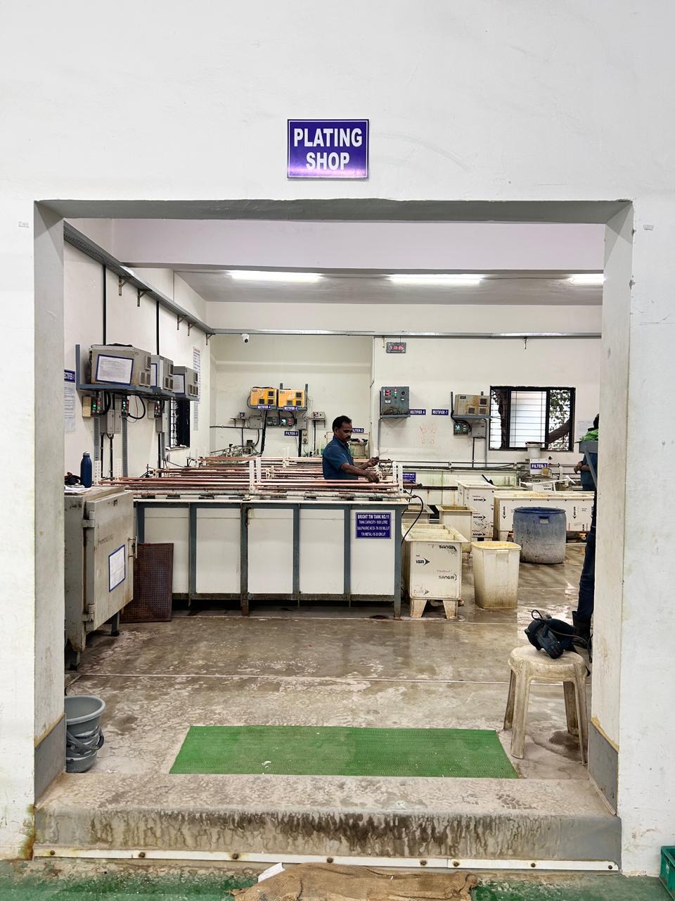 Metal plating plant view with tanks and lines